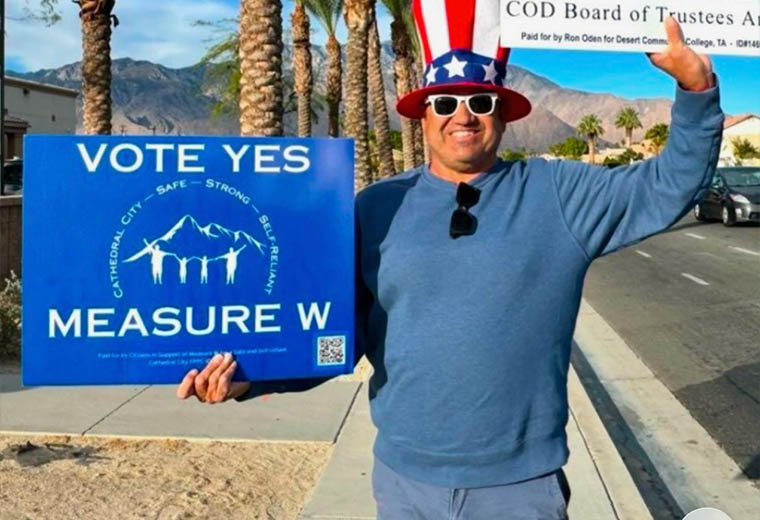Antonio Baciu with a 'Vote Yes on Measure W' sign to support its revenue accountability and build voter trust