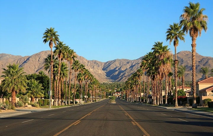 A Cathedral City roadway with mountains in the distance